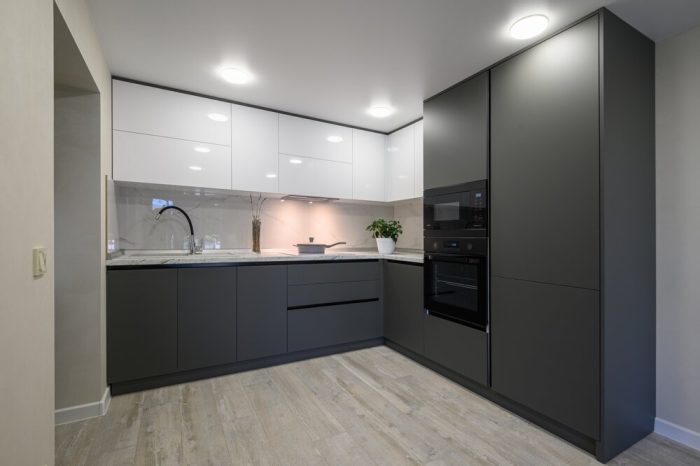 laminate flooring. Modern Simple Trendy Dark Grey And White Kitchen. With laminate flooring.