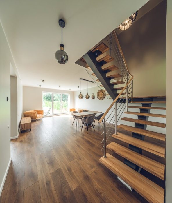 Laminate Flooring. Modern Interior Of Luxury Private House Living Room With Table.
