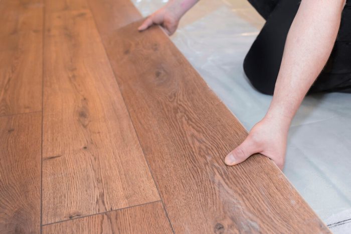 Laminate Flooring. Man,Installs,A,New,Laminated,Wood,Floor.