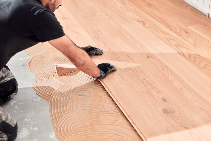 Laminate Flooring. Professional,Handyman,Installing,Laminate,Flooring,In,A,New,Apartment.