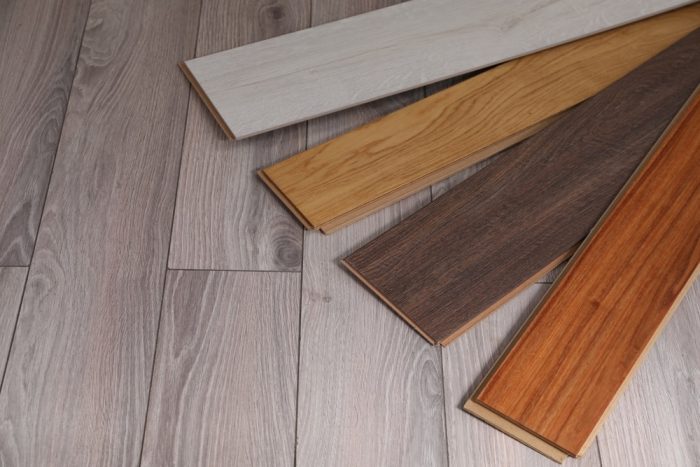 Flooring Trends. Different samples of wooden flooring on surface, space for text.