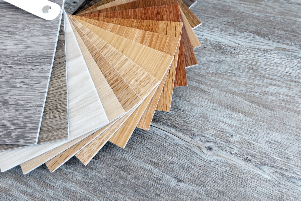 Luxury Vinyl Flooring. sample of luxury vinyl flooring wooden tiles grey tone.