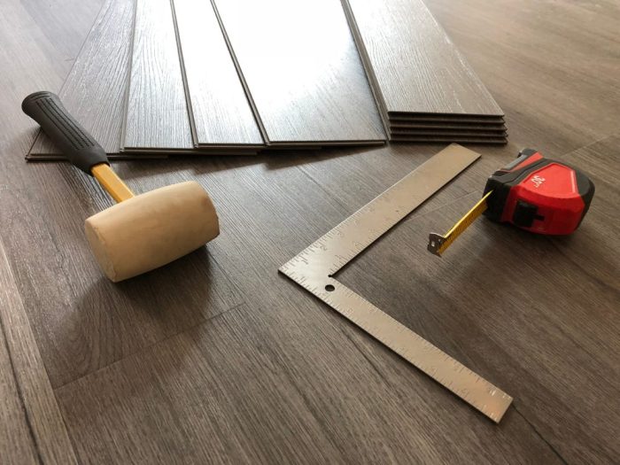 What Is the Difference Between Solid & Engineered Hardwood? interior installation Engineered Hardwood floor and flooring tool.