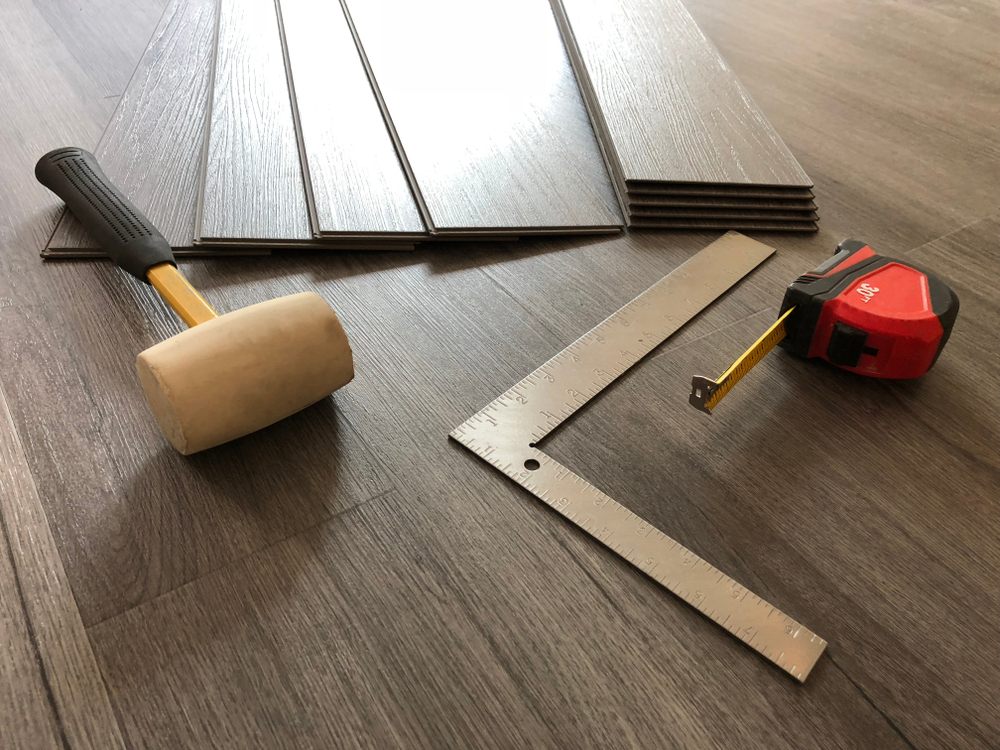 What Is the Difference Between Solid & Engineered Hardwood? interior installation Engineered Hardwood floor and flooring tool.